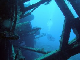 The wreck of a small fishing boat lies in 18m of water outside Mogan harbour